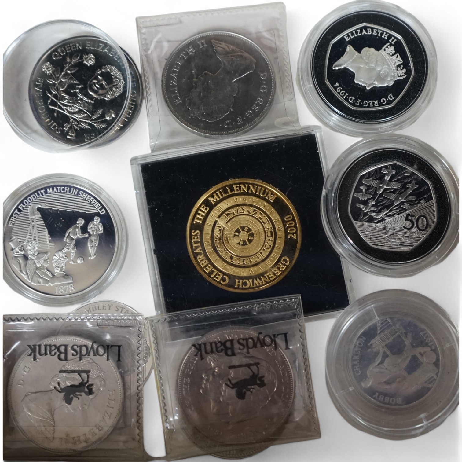 An album of coins and other loose coins, including an 1891 silver crown, 1901 silver trade dollar, commemorative 50p pieces, etc. Condition - fair.